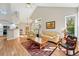 Spacious living room showcases hardwood floors, vaulted ceilings, and an open layout to the kitchen at 2252 S Yosemite Cir, Denver, CO 80231