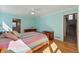 Light-filled main bedroom with hardwood floors, ceiling fan, and ensuite access at 2252 S Yosemite Cir, Denver, CO 80231
