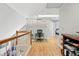 Office space with a built-in bookshelf, natural light and hardwood flooring at 2252 S Yosemite Cir, Denver, CO 80231