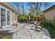 Back patio features a seating area and lush foliage, offering a private retreat at 2252 S Yosemite Cir, Denver, CO 80231
