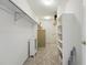 Spacious walk-in closet with built-in shelving and carpet flooring at 2252 S Yosemite Cir, Denver, CO 80231