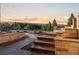 Stone steps lead to a landscaped yard and stunning views of the mountains at 7113 Echo Hills Club Rd, Larkspur, CO 80118