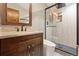 Modern bathroom featuring a glass-enclosed shower, designer fixtures, and a sleek vanity at 7113 Echo Hills Club Rd, Larkspur, CO 80118