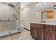 This bathroom features a glass shower and stylish fixtures at 7113 Echo Hills Club Rd, Larkspur, CO 80118