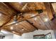 Magnificent wood plank ceiling with exposed beams and recessed lighting adds rustic charm at 7113 Echo Hills Club Rd, Larkspur, CO 80118