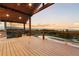 This expansive covered deck offers stunning views of the surrounding landscape at 7113 Echo Hills Club Rd, Larkspur, CO 80118