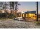 Exterior view shows a patio and backyard with a beautiful sunset at 7113 Echo Hills Club Rd, Larkspur, CO 80118