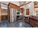 Well-appointed kitchen with stainless steel appliances, custom cabinetry, and stone countertops at 7113 Echo Hills Club Rd, Larkspur, CO 80118