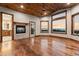 Spacious bedroom with vaulted ceilings, fireplace, and scenic mountain views at 7113 Echo Hills Club Rd, Larkspur, CO 80118