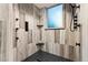 Modern shower features multiple shower heads and sleek tile work at 7113 Echo Hills Club Rd, Larkspur, CO 80118