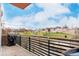 Balcony with black metal railing offers views of the stream and nearby park at 1401 Delgany St # 204, Denver, CO 80202