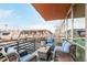 Relaxing balcony area featuring comfortable seating with views of the surroundings and beautiful potted plants at 1401 Delgany St # 204, Denver, CO 80202
