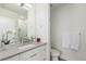 Light and airy bathroom features a vanity sink, toilet and glass shower, creating a clean and serene space at 1401 Delgany St # 204, Denver, CO 80202
