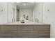 Contemporary bathroom with double vanity, modern fixtures, large mirrors, and plenty of counter space at 1401 Delgany St # 204, Denver, CO 80202