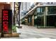Modern exterior with large windows and inviting signage, showcasing an urban base camp concept at 1401 Delgany St # 204, Denver, CO 80202