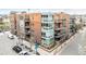 Brick apartment building with balconies and large windows, offering modern urban living at 1401 Delgany St # 204, Denver, CO 80202