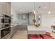 Modern kitchen with stainless steel appliances, sleek cabinetry, stylish lighting, and an island with seating at 1401 Delgany St # 204, Denver, CO 80202