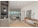 Inviting entryway with a view into the bright and open living room with floor to ceiling windows at 1401 Delgany St # 204, Denver, CO 80202
