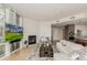 Inviting living area featuring hardwood floors, a modern fireplace, and stylish furnishings throughout open concept space at 1401 Delgany St # 204, Denver, CO 80202