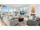 Bright and airy living room featuring floor-to-ceiling windows with city views, modern decor, and comfortable seating at 1401 Delgany St # 204, Denver, CO 80202