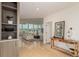 Elegant entryway leading to an open-concept living room with expansive windows offering amazing city views at 1401 Delgany St # 204, Denver, CO 80202