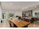 An open concept home with a modern kitchen and a living space with fireplace and large windows providing lots of light at 1401 Delgany St # 204, Denver, CO 80202