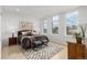 Inviting main bedroom with large windows, hardwood floors, ample natural light, and neutral decor at 1401 Delgany St # 204, Denver, CO 80202