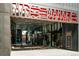 Modern building featuring retail spaces with glass storefronts and a Market Station sign above the entrance at 1401 Delgany St # 204, Denver, CO 80202