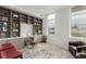 Bright office space with custom shelving, large windows, natural light, and hardwood floors at 1401 Delgany St # 204, Denver, CO 80202