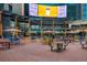 Vibrant outdoor plaza with colorful seating and a large screen, creating an inviting space for entertainment at 1401 Delgany St # 204, Denver, CO 80202