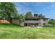 Expansive backyard with patio and mature landscaping at 5 Hillside Dr, Wheat Ridge, CO 80215