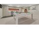 Stylish basement featuring a pool table and kitchenette, perfect for entertaining at 5 Hillside Dr, Wheat Ridge, CO 80215