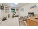 Cozy basement with treadmill, chair, and fitness equipment at 5 Hillside Dr, Wheat Ridge, CO 80215