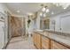 Well-appointed bathroom with a granite countertop vanity, glass shower, and modern fixtures at 5 Hillside Dr, Wheat Ridge, CO 80215