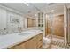 Stylish bathroom features a walk-in shower, modern vanity, and elegant fixtures at 5 Hillside Dr, Wheat Ridge, CO 80215
