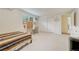 Bright bedroom featuring a desk, closet, and comfortable bed in a neutral color palette at 5 Hillside Dr, Wheat Ridge, CO 80215