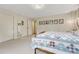 Inviting bedroom featuring a cozy bed with a patchwork quilt and a vanity at 5 Hillside Dr, Wheat Ridge, CO 80215