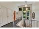 Welcoming entryway with black tiled floors, white walls, and modern lighting fixtures at 5 Hillside Dr, Wheat Ridge, CO 80215