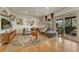 Bright living area with hardwood floors, modern decor, and sliding glass doors to outdoor space at 5 Hillside Dr, Wheat Ridge, CO 80215
