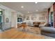 Inviting living room featuring hardwood floors, a comfortable sofa, and a large mirror accent at 5 Hillside Dr, Wheat Ridge, CO 80215