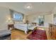 Well-lit main bedroom offering a comfortable bed, stylish furnishings, and a cozy atmosphere at 5 Hillside Dr, Wheat Ridge, CO 80215