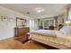 Serene main bedroom with hardwood floors, classic decor, and ample natural light at 5 Hillside Dr, Wheat Ridge, CO 80215