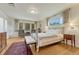 Bright main bedroom featuring a cozy bed, large windows, and elegant furnishings at 5 Hillside Dr, Wheat Ridge, CO 80215