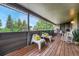 Outdoor patio with comfortable seating, charming string lights, and a view of mature trees at 5 Hillside Dr, Wheat Ridge, CO 80215
