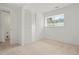 Bedroom features a window, bi-fold closet, and access to the home's utility room at 16322 E Idaho Pl, Aurora, CO 80017