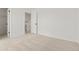 Bright bedroom featuring neutral carpeting and an open doorway leading to the home's next level at 16322 E Idaho Pl, Aurora, CO 80017