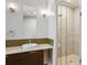 Bright bathroom with a single vanity, attractive lighting, and a glass-enclosed shower at 2335 Walnut St # 10, Denver, CO 80205