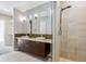 Modern bathroom features a double vanity, stylish fixtures, and a glass-enclosed shower at 2335 Walnut St # 10, Denver, CO 80205