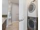 Modern bathroom featuring a walk-in shower, in unit laundry, and vanity with a vessel sink at 2335 Walnut St # 10, Denver, CO 80205