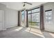 Bright bedroom with large windows and light gray carpet at 2335 Walnut St # 10, Denver, CO 80205